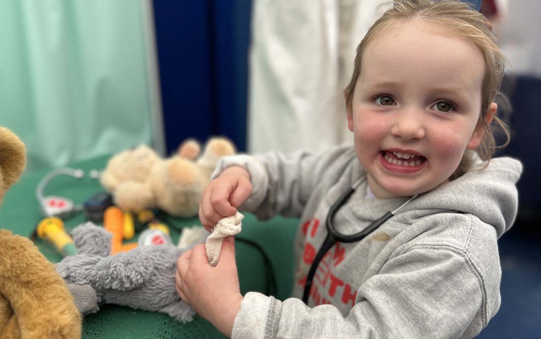 A child enjoying tjhe Teddy Hospital