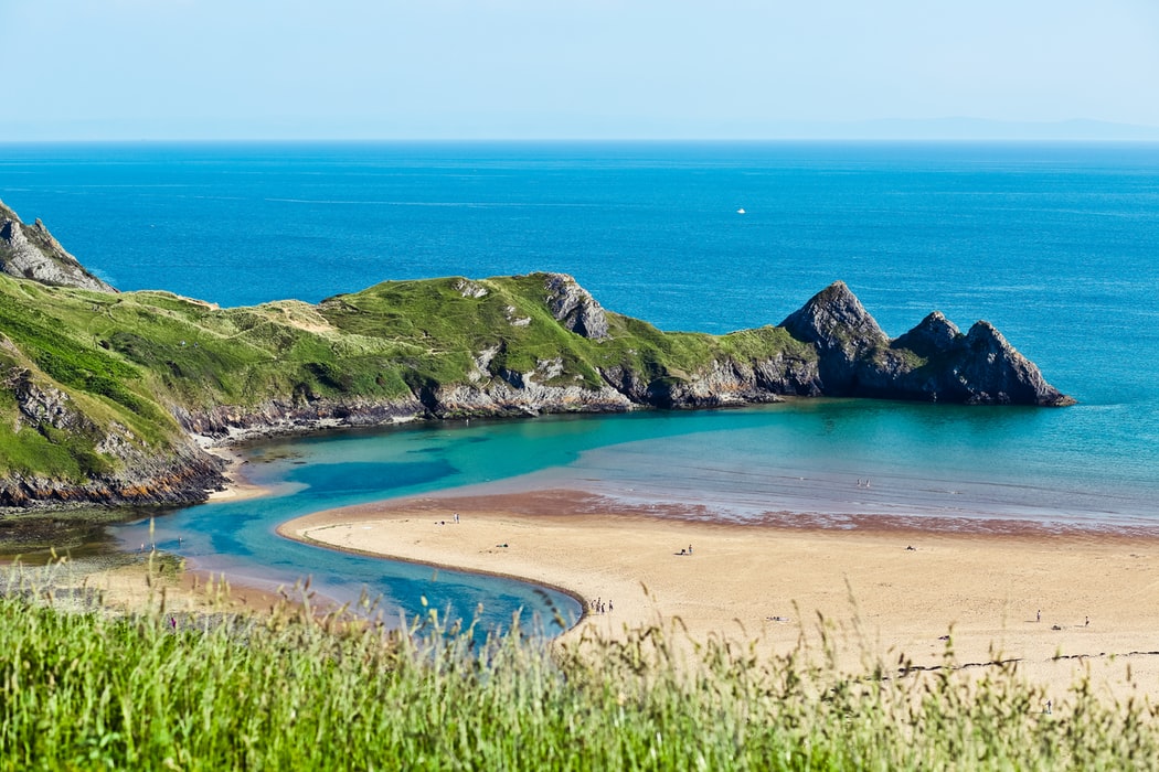 View of Three Cliffs Bay on a sunny day 