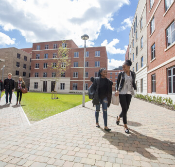 students walking around the Bay Campus accommodation