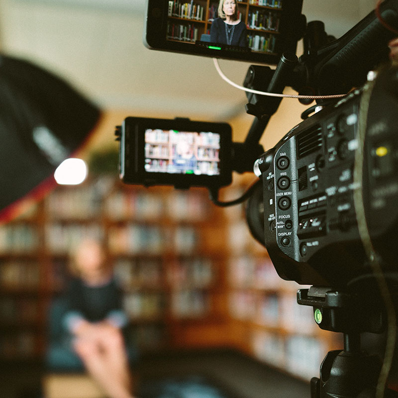 A camera recording a person