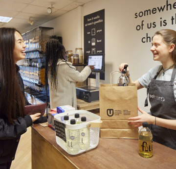 Students buying goods in Root Zero 