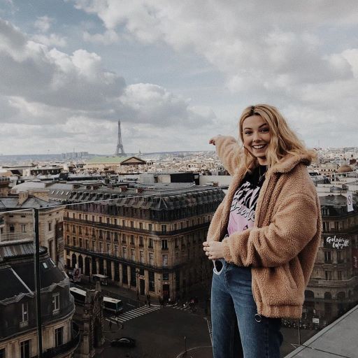 Student pointing out at Paris landscape