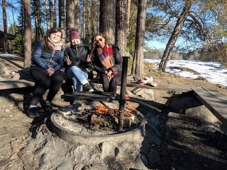 students sat around a fire pit