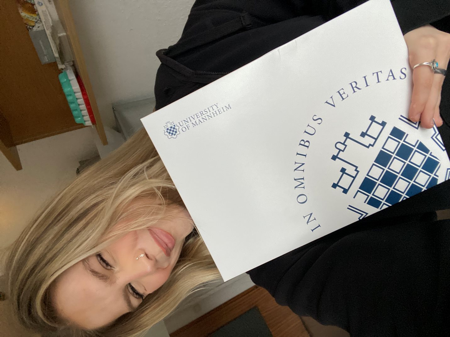 Alina holding Mannheim prospectus