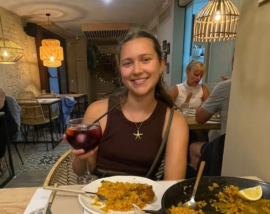 Lucy eating in a restaurant. 