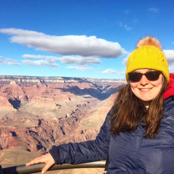 student in front of canyon