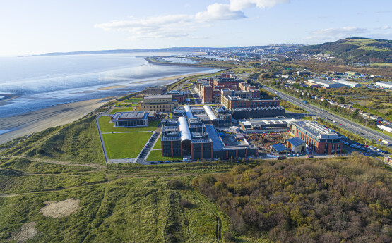 Aerial view shot of Bay campus and it's proximity to the beach