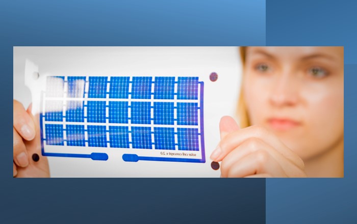 Woman holds a solar cell on a flexible film.