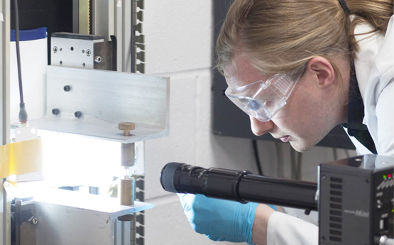 Researcher using lab equipment