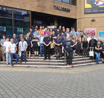 A group of technicians outside the taliesin