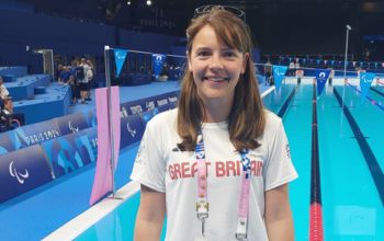 Verity Cook in the Team GB kit in Paris next to the arena pool 