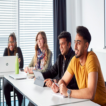 Four students in a classroom