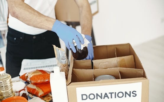 Volunteer sorting donations at a food bank